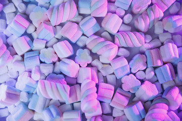 Pink and white marshmallows in neat rows with soft pastel lighting. Sweet candy background for desserts, holidays, parties, birthdays, Valentine’s Day, and bakery designs.