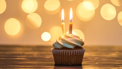 Cupcake Celebration A Sweet Treat with Two Candles Burning Brightly in Festive Lights