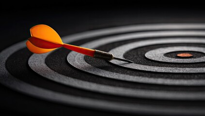 An orange-fletched dart perfectly hitting the bullseye of a dark, concentric target, symbolizing precision and success.