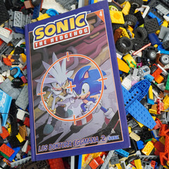 Naklejka premium Sonic the Hedgehog comic book with Silver and Sonic characters, surrounded by colorful toy bricks