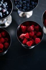 Fresh berries in the bright sun on the dessert table