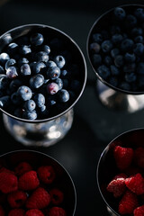 Fresh berries in the bright sun on the dessert table