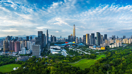 Fototapeta premium Panoramic view of the modern city skyline with commercial skyscrapers and a large green central park in Shenzhen.