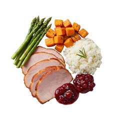White ceramic plate with honey-glazed ham, green asparagus, roasted sweet potato, fluffy rice, rich gravy, and bright cranberry sauce on transparent background, soft light, flat lay. Wholesome