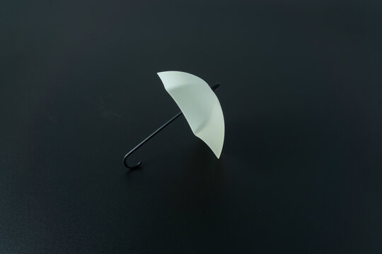 Umbrella toy on black background - Powered by Adobe