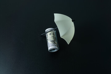 Umbrella toy and dollar banknote