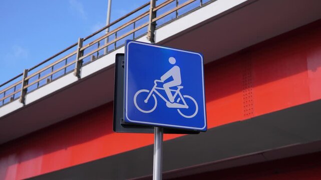 Bike path sign with Rome&rsquo;s eastern ring road in the background