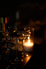 Empty clear glasses in the candlelight