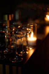 Empty clear glasses in the candlelight