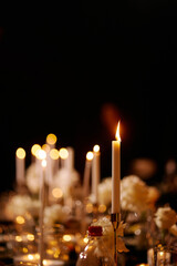 Decorative atmospheric candles on the festive table