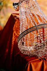 Holiday decorations with apricots, watermelons and medieval fabrics and chandeliers