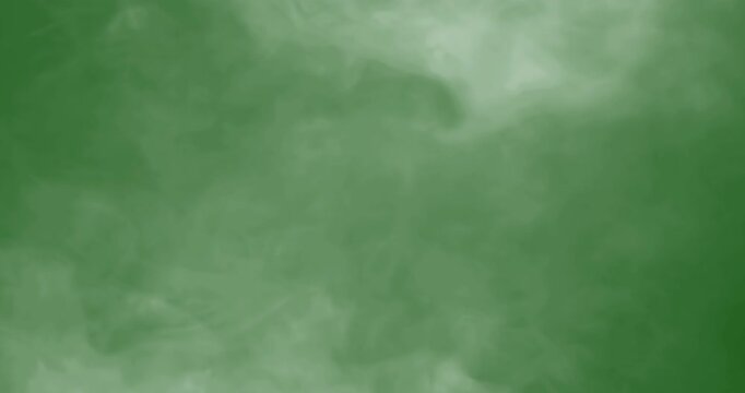smoke slowly floating through space against chroma key green screen