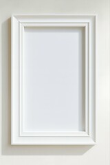 Empty white wooden picture frame hanging on a blank wall decoration