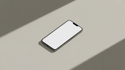 Modern smartphone with blank screen on neutral surface with soft shadow lighting