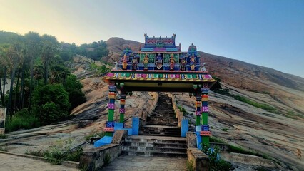 Colorful kasi viswanathar temple entrance and stone steps leading up Thiruparankundram Hill in...