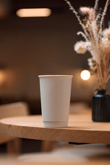 Takeaway Coffee in Cozy Café Interior