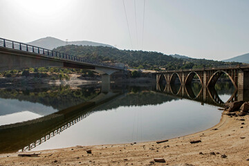 A bridge and its reflection on the water