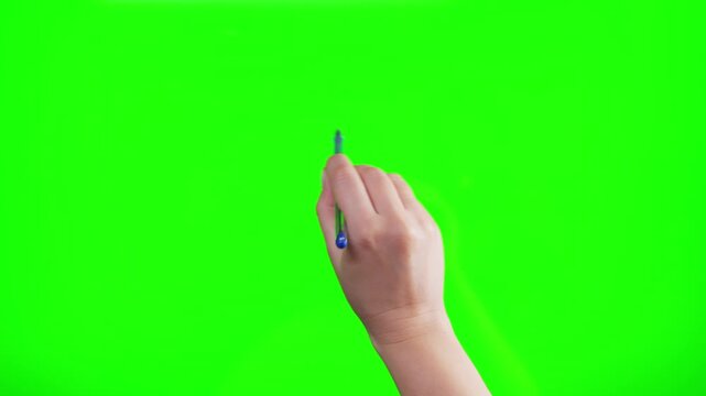 A woman's hand holding a pen on green screen, writing on chroma key. Hand signs on a green screen.
