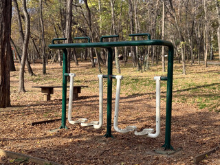Fototapeta premium Outdoor stepper machines in park. Balance, coordination, and strength expressing active recreation and outdoor wellness.