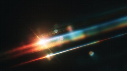 Commercial high-resolution photo of abstract light streaks with lens flare and bokeh effects on black background.