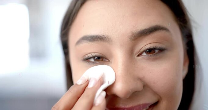 Woman demonstrating skincare placing cotton pad at eye, wiping inward, creating red green overlays
