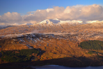 Obraz premium Winter view from the summit of Ben More mountain in the Breadalbane region of the southern Scottish Highlands, near Crianlarich, Scotland, United Kingdom