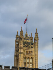 Beautiful night an Sunset view of Big Ben and the Houses of Parliament in London, illuminated over the River Thames with city lights reflecting on the water. UK
