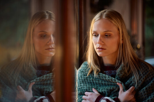Young sad woman spending Christmas alone at home.