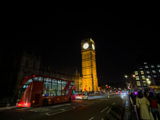 Beautiful night an Sunset view of Big Ben and the Houses of Parliament in London, illuminated over the River Thames with city lights reflecting on the water. UK