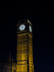 Beautiful night an Sunset view of Big Ben and the Houses of Parliament in London, illuminated over the River Thames with city lights reflecting on the water. UK