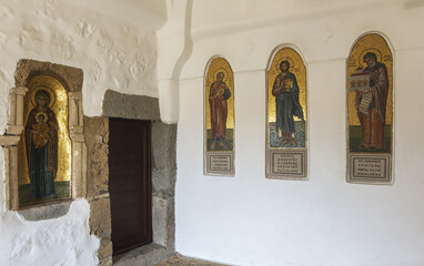 Interior of monastery,  religious paintings, arched doorway, ancient architecture, spiritual setting in the Monastery of Saint John the Theologian on the island of Patmos, Greece.