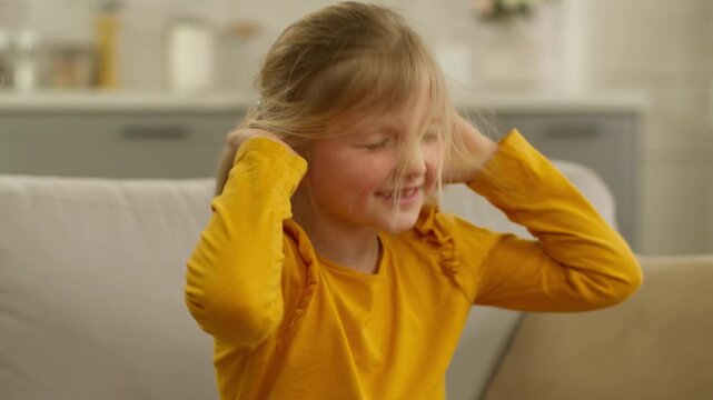 Portrait Caucasian little girl child kid daughter shaking head negative rejected denied naughty baby emotional shake no not covering ears with hands hyperactive panic attack emotional protest trouble