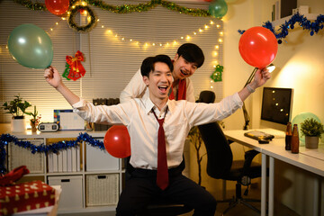 Holiday fun takes over the office with a spontaneous chair ride, festive laughter, and balloon filled joy before the Christmas break
