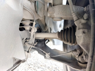 Close-up view of car suspension parts under review