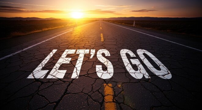 A road stretching into the distance with the words 'Let's Go' painted on it.