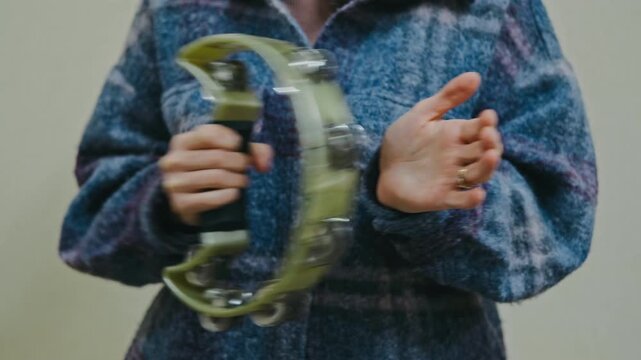 plaid shirt adds warm ambiance, music scene enriched by rhythmic tambourine and plaid shirt style