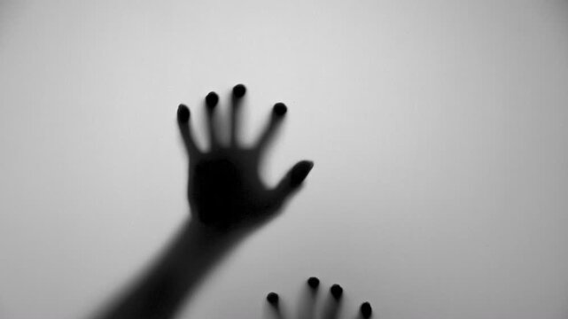 Shadowed Embrace: A gripping black and white image, hands reaching out, evoke a sense of longing, mystery, and a touch of the unknown.