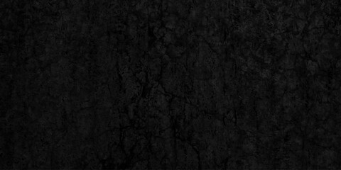 Black dark grunge stone texture with rough, natural wall surface background. uneven pattern resembling weathered black rock or charcoal. Panorama black canvas slate texture. blackboard background.