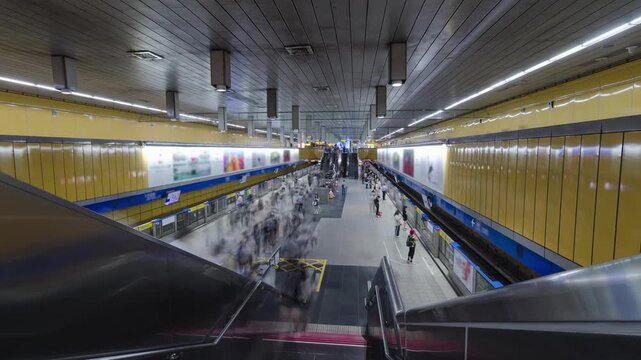 top down timelapse view of crowded passenger get on and get off from subway train while train arrive and depart from platform subway in rush hour.Timelapse people at taipei underground station