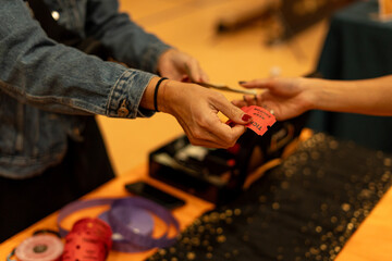 Women handling money giving to other person and receiving ticket - purchase concept of two people