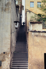 narrow street of steps between buildings in old town Prague