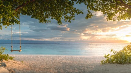 A wooden swing hangs from a large tree branch on a sandy beach during daylight, with calm ocean waves and clear blue sky in the background.