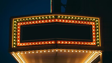 Blank Retro Theater Marquee Sign with Glowing Lights at Night.