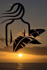 Silhouette of a woman at sunset