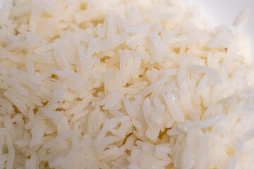 Close up shot of the cooked white rice in the bowl. Food