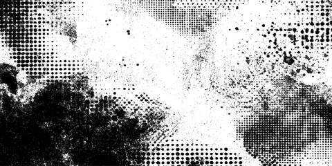 Abstract black and white halftone dot grunge splatter texture background.