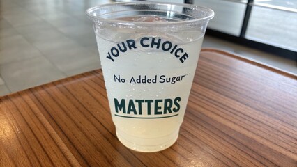 Transparent Cup of Drink with No Added Sugar on Wooden Surface