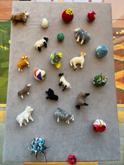 Wool felt animals and handmade decorations on display. Craftsmanship, creativity, and cultural expression through traditional art.