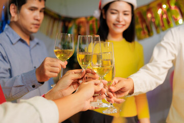 Festive gathering: friends toasting to the end of the year.