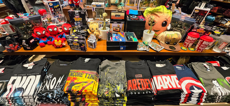 Marvel-themed merchandise display with colorful t-shirts and collectibles